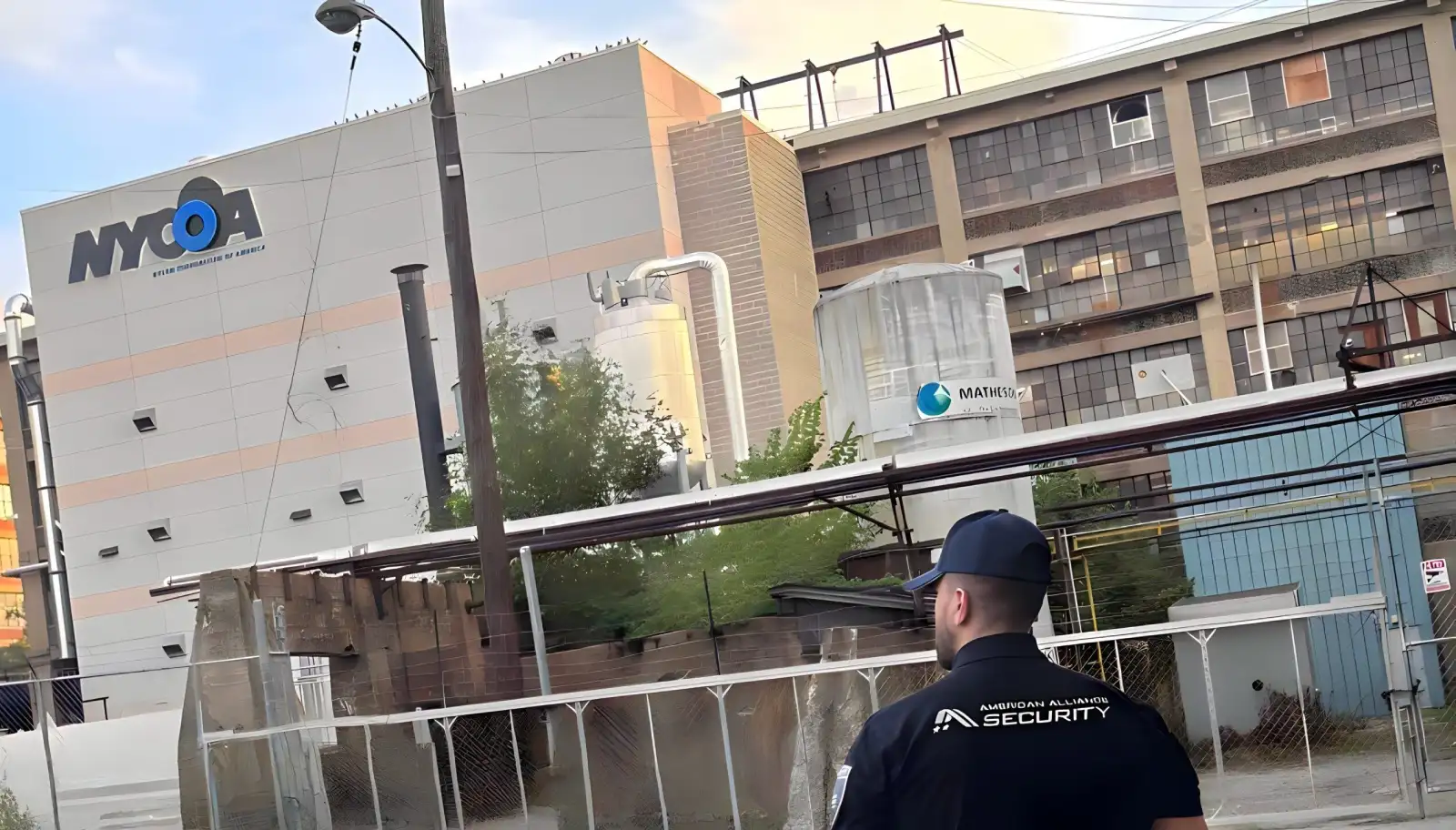 An American Alliance Security officer walking the grounds of an industrial facility