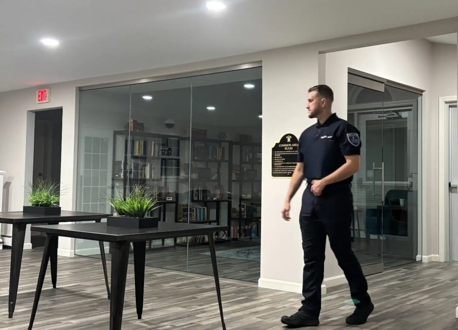 A security officer walking through a building lobby